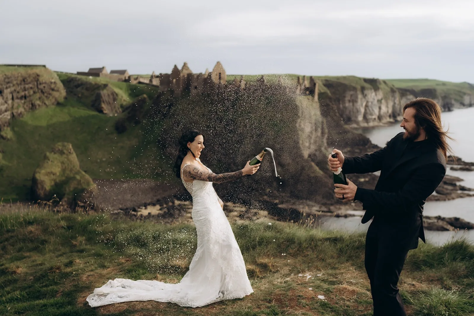 Newlyweds opening champagne after their ceremony